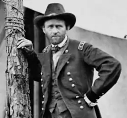 American Civil War general standing by tree