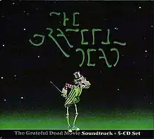 A dancing skeleton wearing an Uncle Sam hat and coat and sneakers and holding a cane