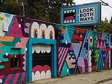 Mural by Greg Mike in Inman Park featuring Larry Loudmouf