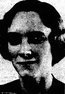 Newspaper photo of thin white woman with dark hair.
