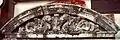 Multiple section terra cotta in the tympanum, a form used over windows and doors.