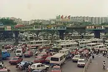 The east square of Guangzhou railway station in 1991. Notice the prevalence of traditional Chinese characters as brand logos during that time, including Jianlibao (健力寶), Rejoice (飄柔) and 萬家樂; only Head & Shoulders (海飞丝) printed in simplified. In Mainland China, it is legal to design brand logos in traditional characters, yet by 2020, apart from Jianlibao, the other three have changed to simplified.