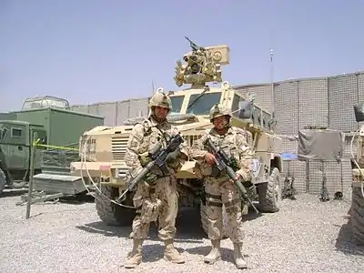 Guards posing in front of an RG-31