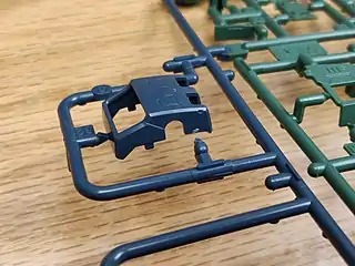 Body panel cut away from sprue, showing nub