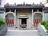 Image 36A Mazu temple in Shek Pai Wan; It clearly shows traits of classical Lingnan style - pale colour, rectangular structures, use of reliefs, among others. (from Culture of Hong Kong)