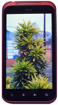 The HTC Incredible S smartphone displaying the device's default home screen.