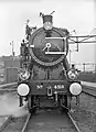 Steam locomotive NS 4310 (ex War Department no. 70863) at the central workshop in Tilburg, with decorations due to the fact that this was the last steam locomotive to be overhauled in the workshop in Tilburg. (07-06-1955)