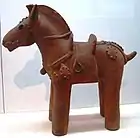 Haniwa horse statuette, complete with saddle and stirrups, 6th century, Japan.