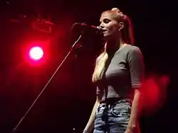 Reid performing with London Grammar in August 2013