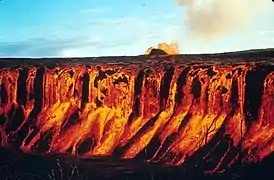 A cascade of molten lava flowing into Aloi Crater during the 1969-1971 Mauna Ulu eruption of Kilauea volcano
