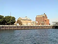 Hart's Mill (1855, centre) and the Adelaide Milling Company flour mill (c.1890, right) are prominent landmarks adjacent to the southern wharf of the Inner Harbour at Port Adelaide..mw-parser-output .geo-default,.mw-parser-output .geo-dms,.mw-parser-output .geo-dec{display:inline}.mw-parser-output .geo-nondefault,.mw-parser-output .geo-multi-punct{display:none}.mw-parser-output .longitude,.mw-parser-output .latitude{white-space:nowrap}34°50′33.2″S 138°29′58.4″E﻿ / ﻿34.842556°S 138.499556°E﻿ / -34.842556; 138.499556