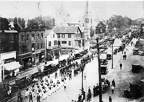 A parade on Washington Street, Norwood, c. 1920.  Looking north towards Norwood Common (on right in distance)