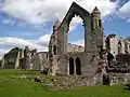 West side of the abbey, showing (from right) exterior of Abbot's hall, kitchens, refectory undercroft, main cloister.