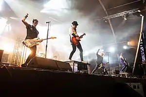 Sum 41 at Hellfest 2019. from left to right: Bassist Jason McCaslin, drummer Frank Zummo, guitarist Tom Thacker, lead vocalist Deryck Whibley, and guitarist Dave Baksh.