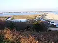 Sand bar at end of Christchurch Harbour, viewed from Hengistbury Head