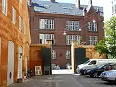 The gate towards Vester Voldgade and to the left the gable of the Hay Storage Building