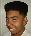 Image 56African-American teenager with Hitop fade, popular in the early 1990s. (from 1990s in fashion)