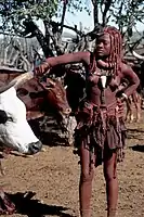 Himba girl at work
