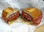 A submarine sandwich, which includes a variety of Italian luncheon meats