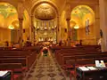 The church interior. Notice the sanctuary dome which is a copy of that of St. Clemente Bascilica Rome.