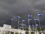 Salvadoran flag stand in front of Hospital El Salvador