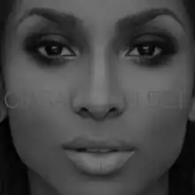 A black-and white portrait of a close-up of an African-American woman's face with the name Ciara and the title "I Bet" centered in the portrait in feint white capital font.