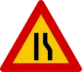 Road narrows on right hand side