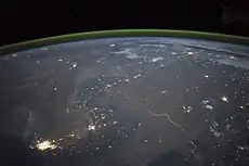 The winding border between Pakistan and India is lit by security lights. It is one of the few places on Earth where an international boundary can be seen at night.