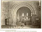 Interior showing the very fine Norman chancel arch, photographed ca. 1890