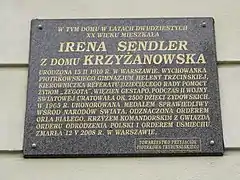 A bronze plaque in Piotrków Trybunalski telling some of her story
