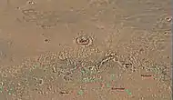 Map of Ismenius Lacus quadrangle which is located just north of Arabia, a large bright area of Mars.  It contains large amounts of ice in glaciers that surround hills.
