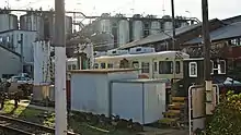 Former Iyo Railway 700 series EMU cars MoHa 713 and KuHa 763 undergoing conversion/repainting work at Nakanocho Depot in October 2015