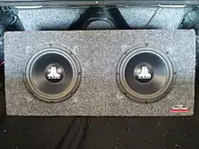 Two 10-inch subwoofers in the trunk of a car