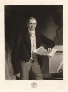 Standing mezzotint portrait of James Gibson-Craig in a tailcoat and cravat, with a paper in his hand