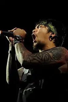 Garcia performing with Slapshock at the University of the Philippines in 2011.