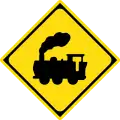 Traffic signs often use silhouettes. This sign warns that the road crosses a railway line.