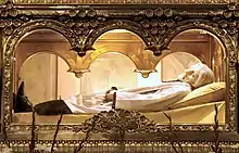 The body of Saint John Mary Vianney wearing a wax mask, found to be incorrupt by the Catholic Church. (b. 8 May 1786 – d. 4 August 1859).