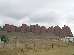 A view of Jeti-Ögüz rock formation that includes one of the buildings of the health resort (right)