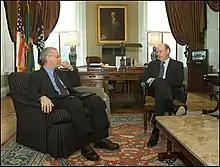 Chernow (left) with John W. Snow in 2004