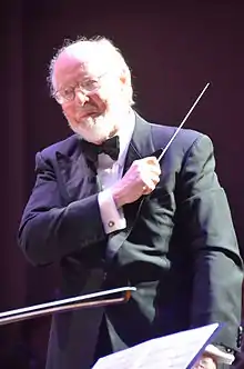 Williams in 2011, conducting the Boston Pops Orchestra