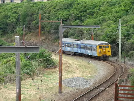 A southbound DM class EMU just south of Raroa Railway Station on the Johnsonville Line in 2007. The last of the DM class EMUs was withdrawn from the line in February 2012.