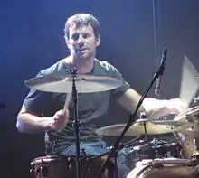 Coghill performing with Powderfinger at the Across the Great Divide tour on 8 September 2007.