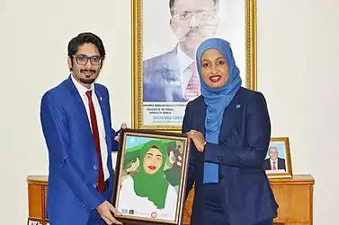 Junaib Abbasi presented portrait of H.E.Mrs Khadija Mohamed Almakhzumi