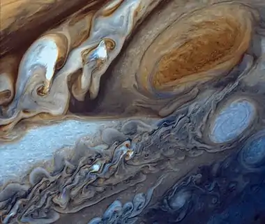 Image 11Great Red SpotPhoto credit: Voyager 1False-color detail of Jupiter's atmosphere, imaged by Voyager 1, showing the Great Red Spot and a passing white oval. The wavy cloud pattern to the left of the Red Spot is a region of extraordinarily complex and variable wave motion. To give a sense of Jupiter's scale, the white oval storm directly below the Great Red Spot is approximately the same diameter as Earth.More selected pictures