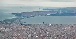 Aerial view above Cumhuriyet neighborhood lying by the shores of & overlooking the Lake of Küçükçekmece.