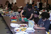 Students building at their pit tables during the 2009 World Championships.