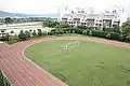The 300-meter running track and the soccer field in Kunming International Academy