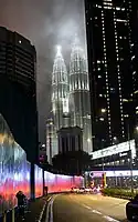Exterior of the KLCC illuminated at night.
