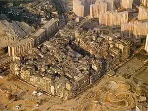Image 33By 1990, the Kowloon Walled City contained 50,000 residents within its 2.6-hectare (6.4-acre) borders. (from History of Hong Kong)