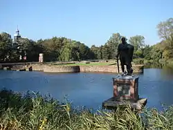 Lamoral, Count of Egmont before the remains of Castle den Hoef (Castle Egmond), and in the background the 13th-century castle chapel which was fully restored in the 17th century